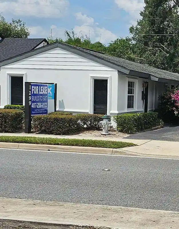 Small commercial building with a roadside sign